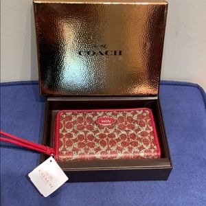 Brand new red Coach leather zip around wristlet